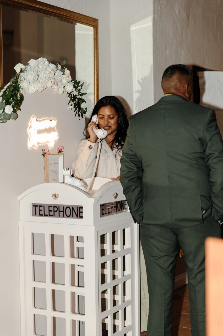 A wedding guest leaving a voice message on a vintage telephone